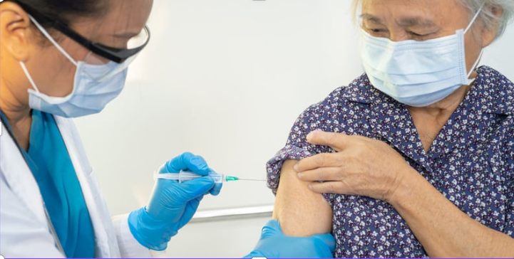 malaysian senior taking influenza vaccine